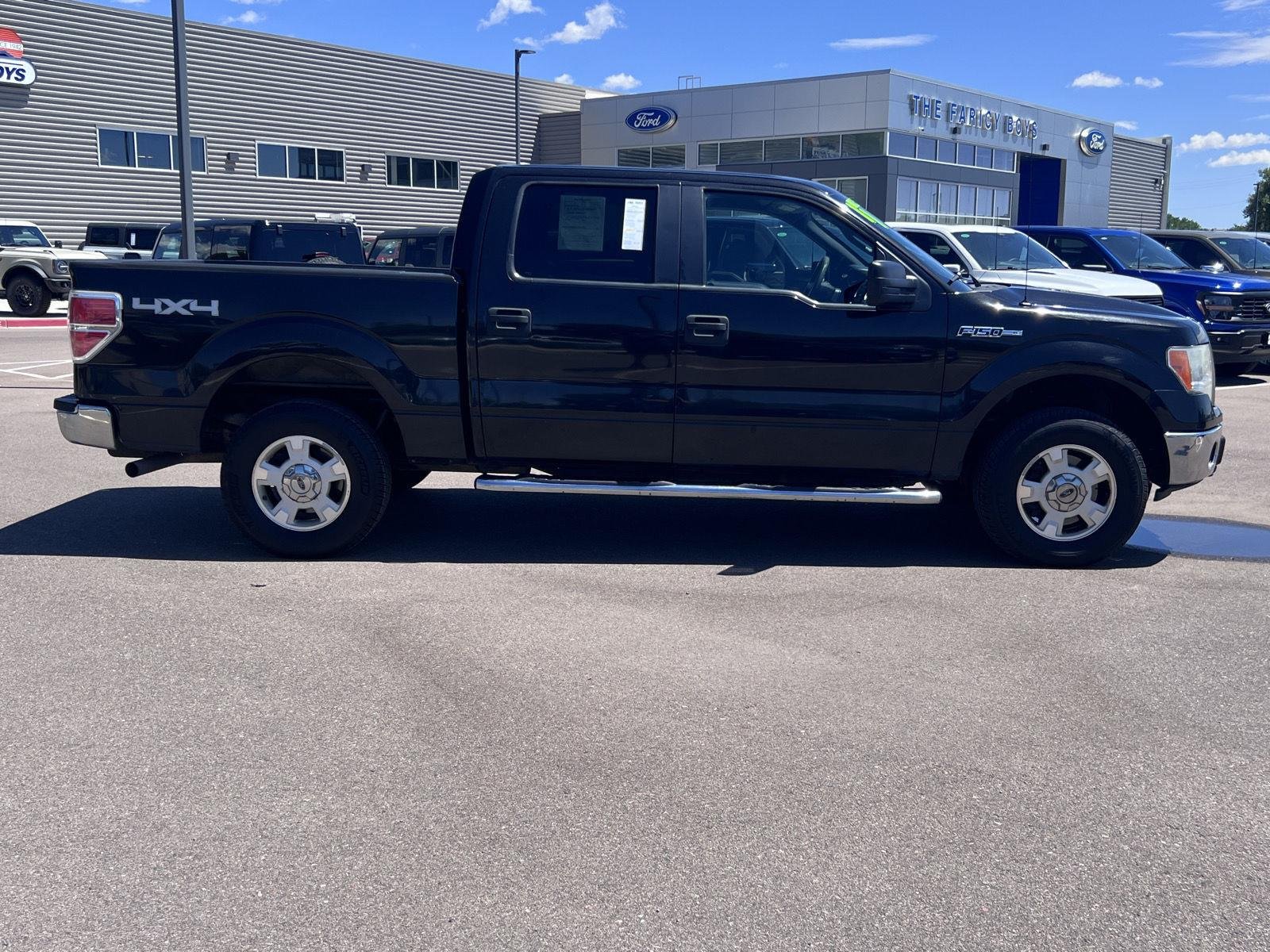 Used 2011 Tuxedo Black Metallic Ford XLT image 4