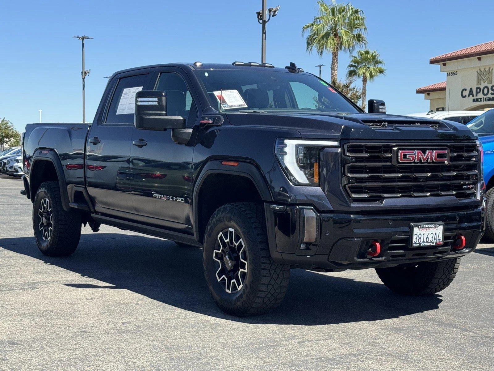 Used 2024 Titanium Rush Metallic GMC AT4X image 1
