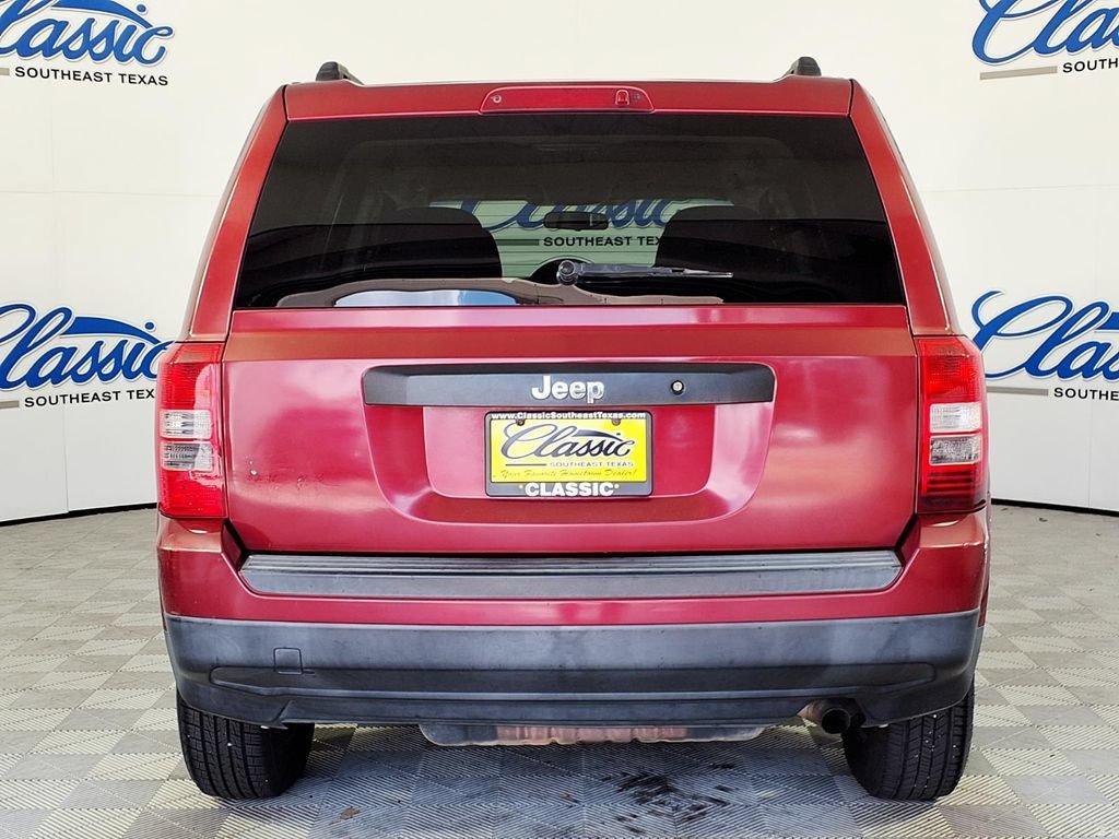 Used 2011 Deep Cherry Red Jeep Sport image 4