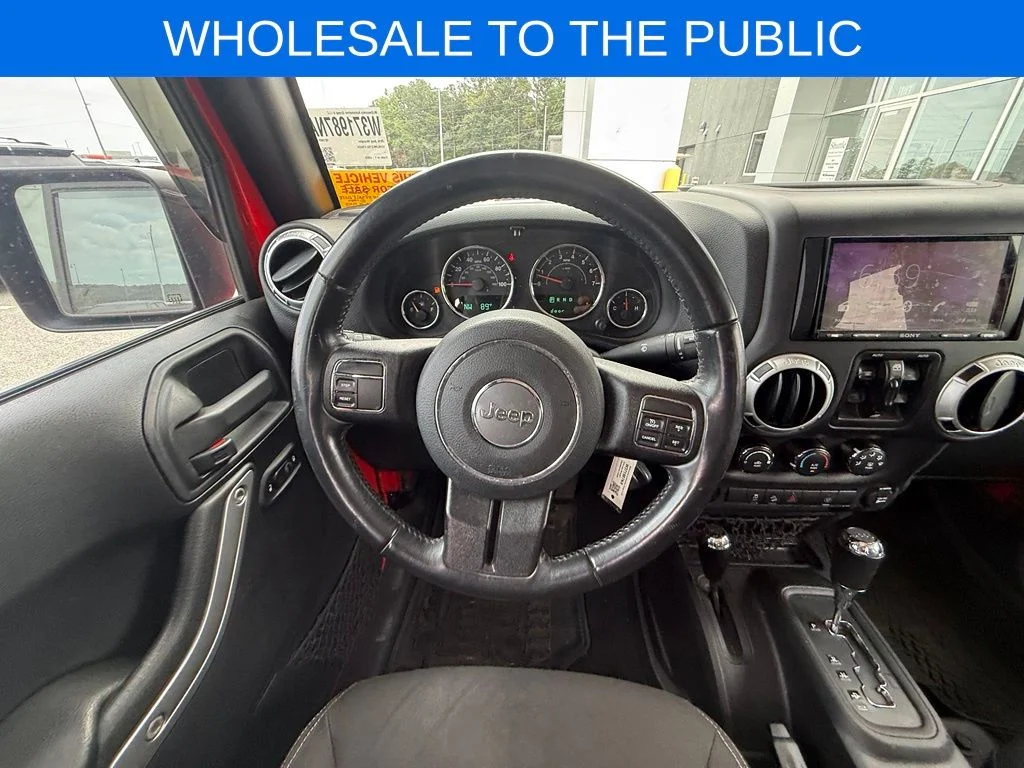 Used 2016 Red Jeep Unlimited Sahara image 11