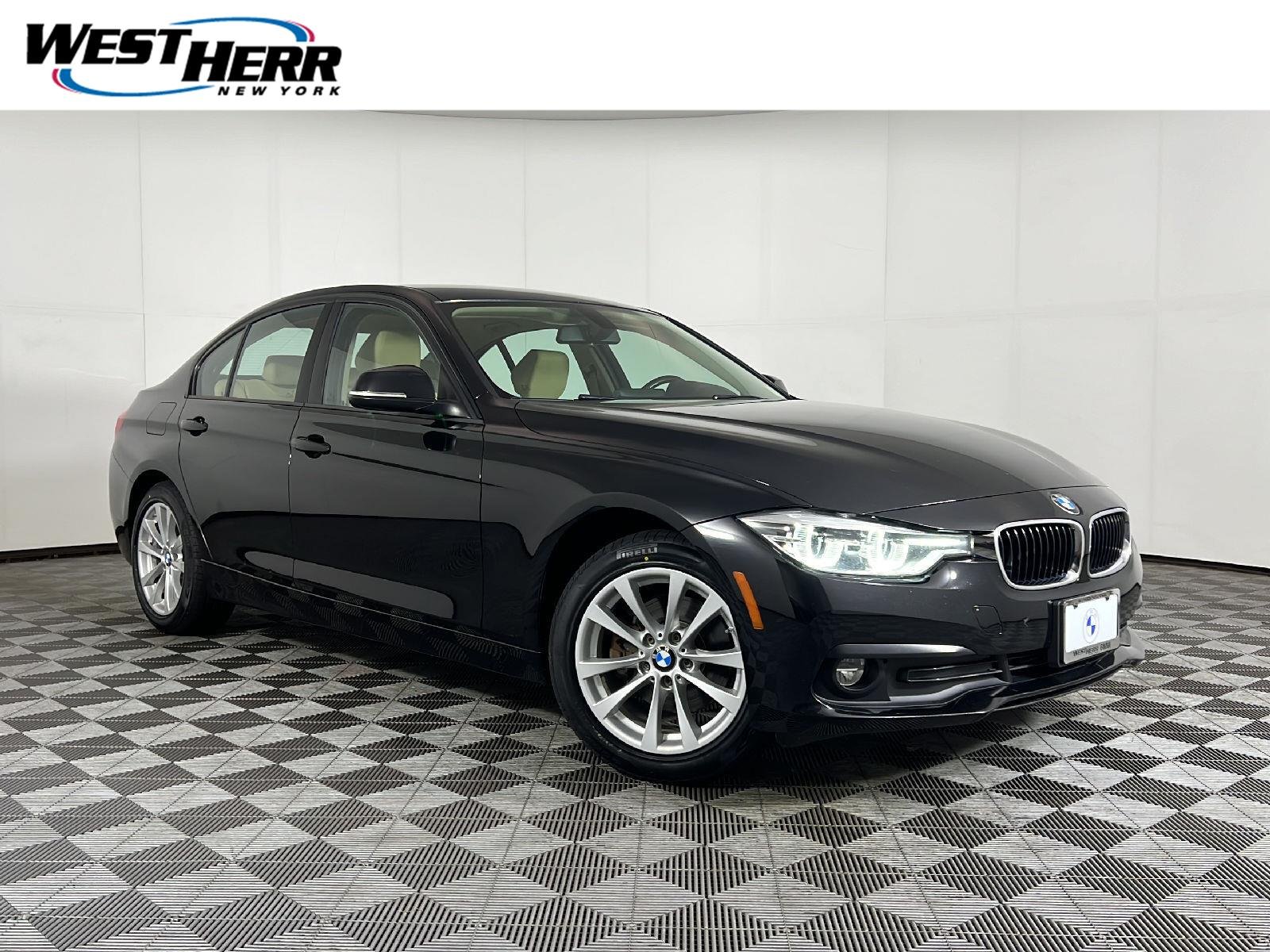 Used 2018 Jet Black BMW 320i xDrive image 1