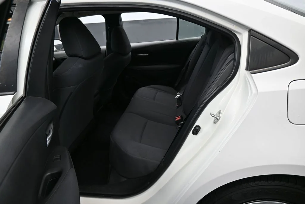 Used 2021 Super White Toyota LE image 24