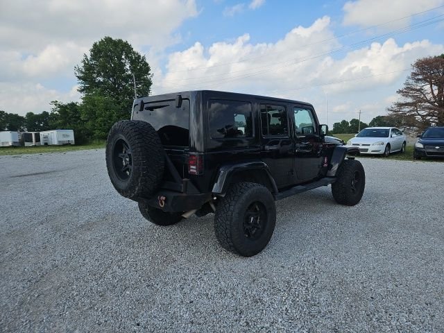 Used 2013 Black Jeep Unlimited Sahara image 6