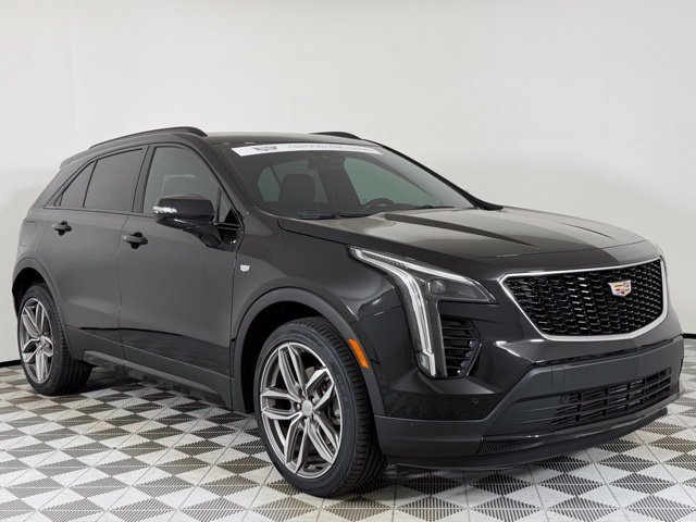 Used 2023 Stellar Black Metallic Cadillac Sport image 1
