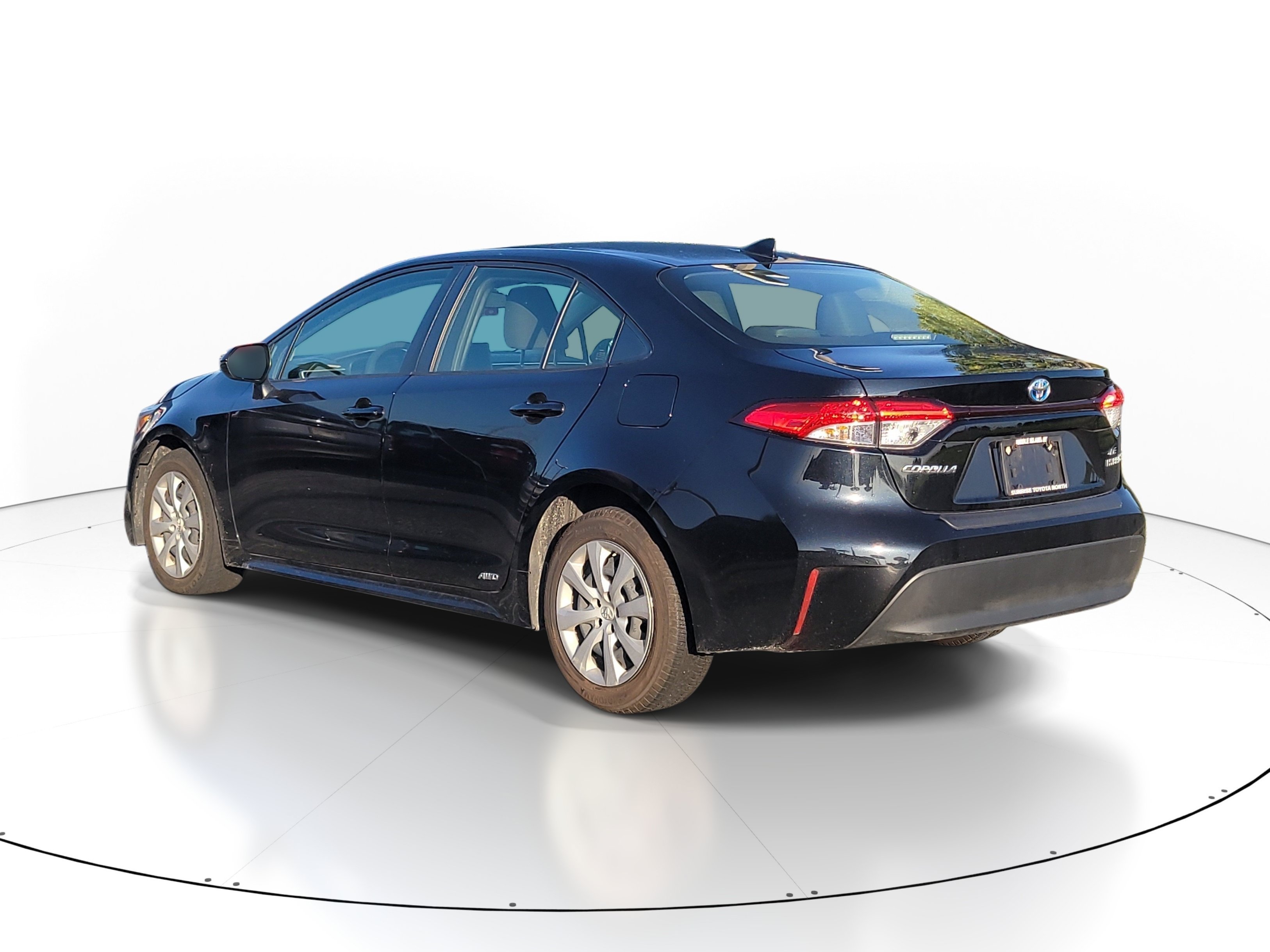 Used 2023 Midnight Black Metallic Toyota Hybrid LE image 4