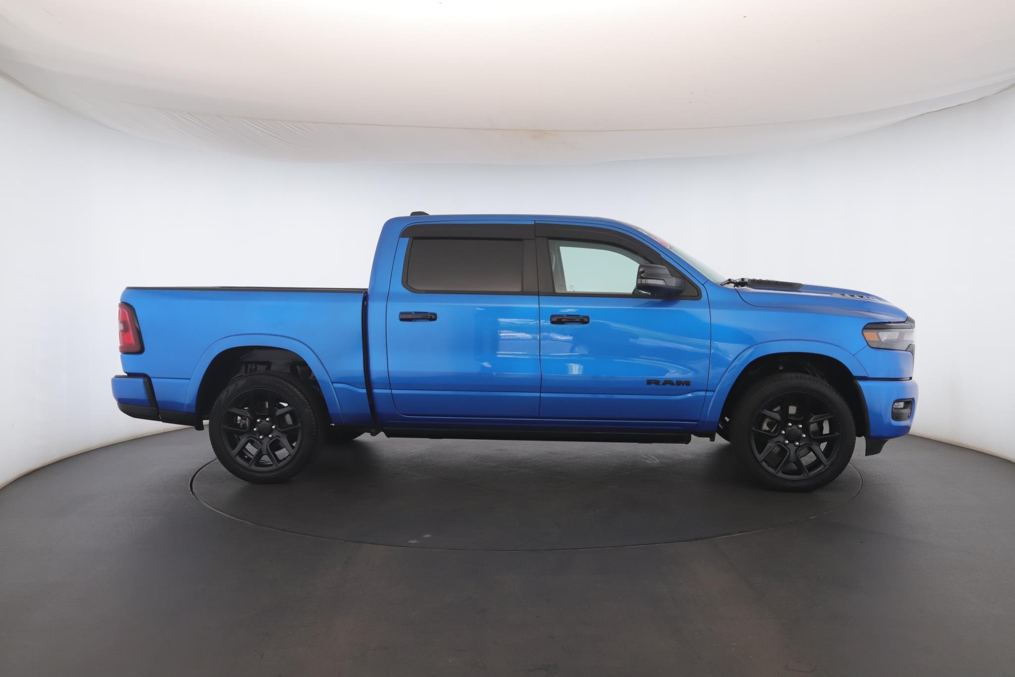 Used 2025 Hydro Blue Pearlcoat Ram Laramie 4x4 Crew Cab 5