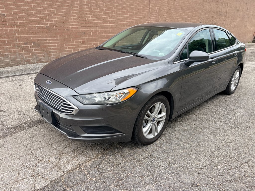 Used 2018 Magnetic Metallic Ford SE image 1