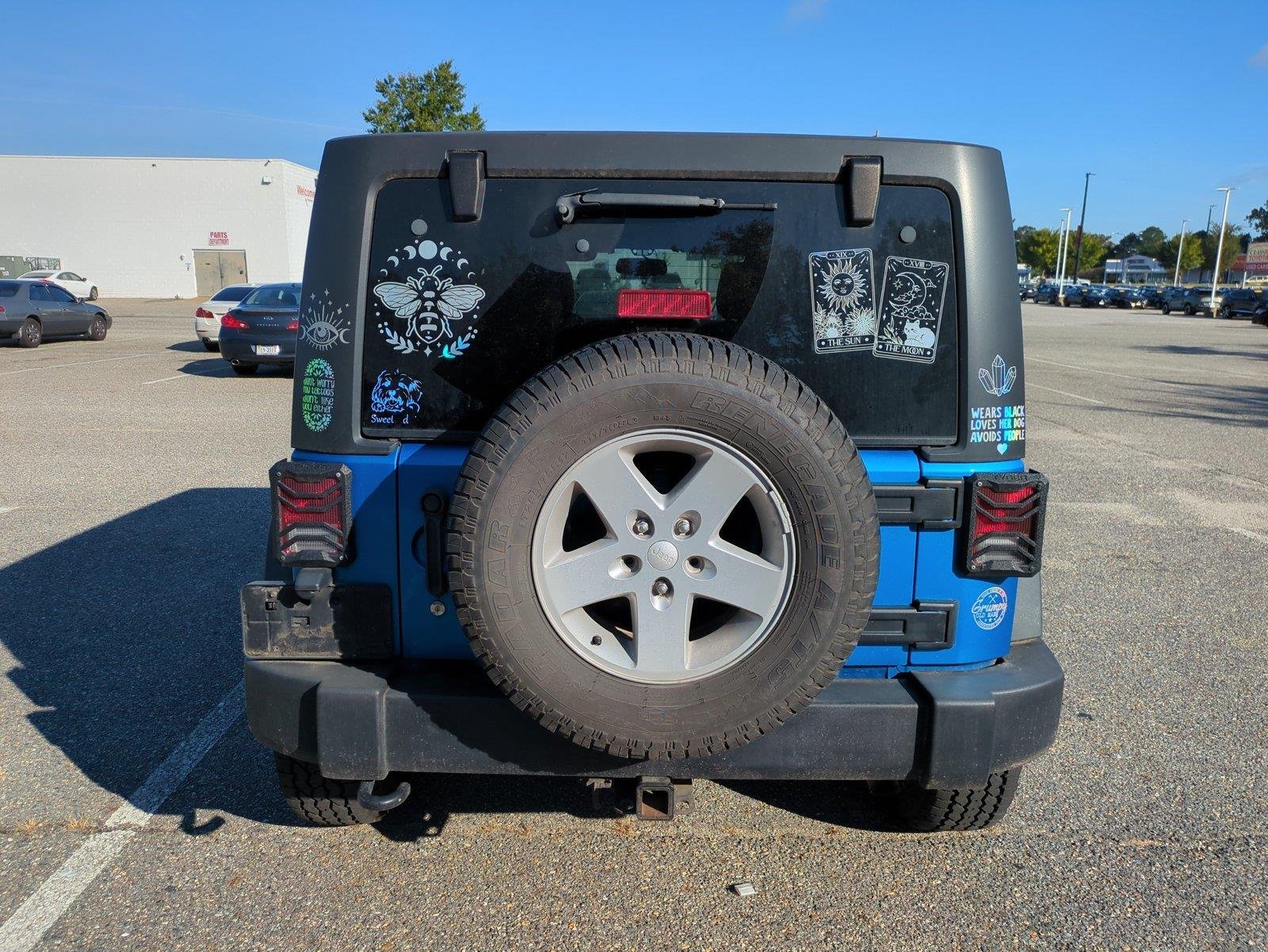 Used 2015 Hydro Blue Pearl Coat Jeep Sport image 4