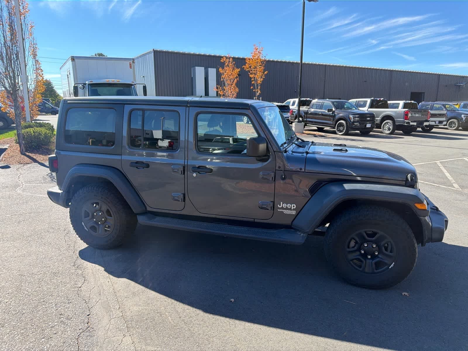 Used 2018 Granite Crystal Metallic Clearcoat Jeep Sport image 5
