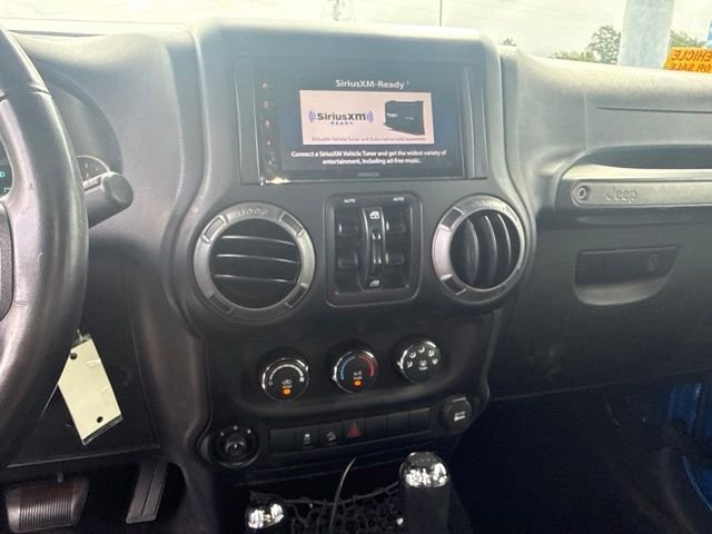 Used 2015 Blue Jeep Unlimited Sport image 16