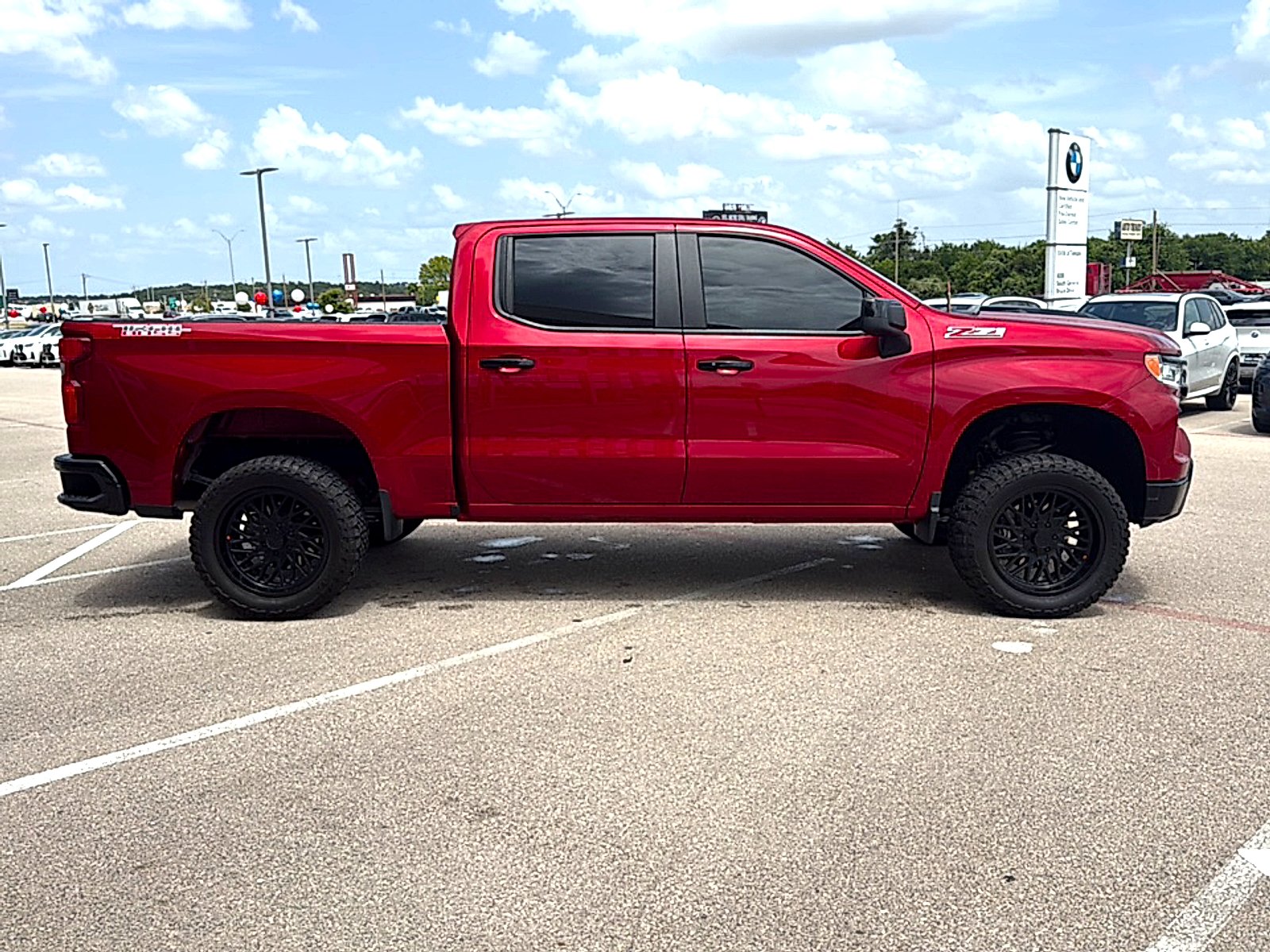 Used 2025 Radiant Red Tintcoat Chevrolet 4WD Crew Cab Short Bed LT Trail Boss image 5