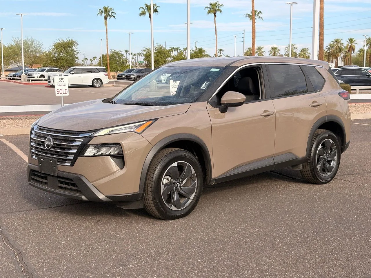 Used 2025 Baja Storm Metallic Nissan SV image 1