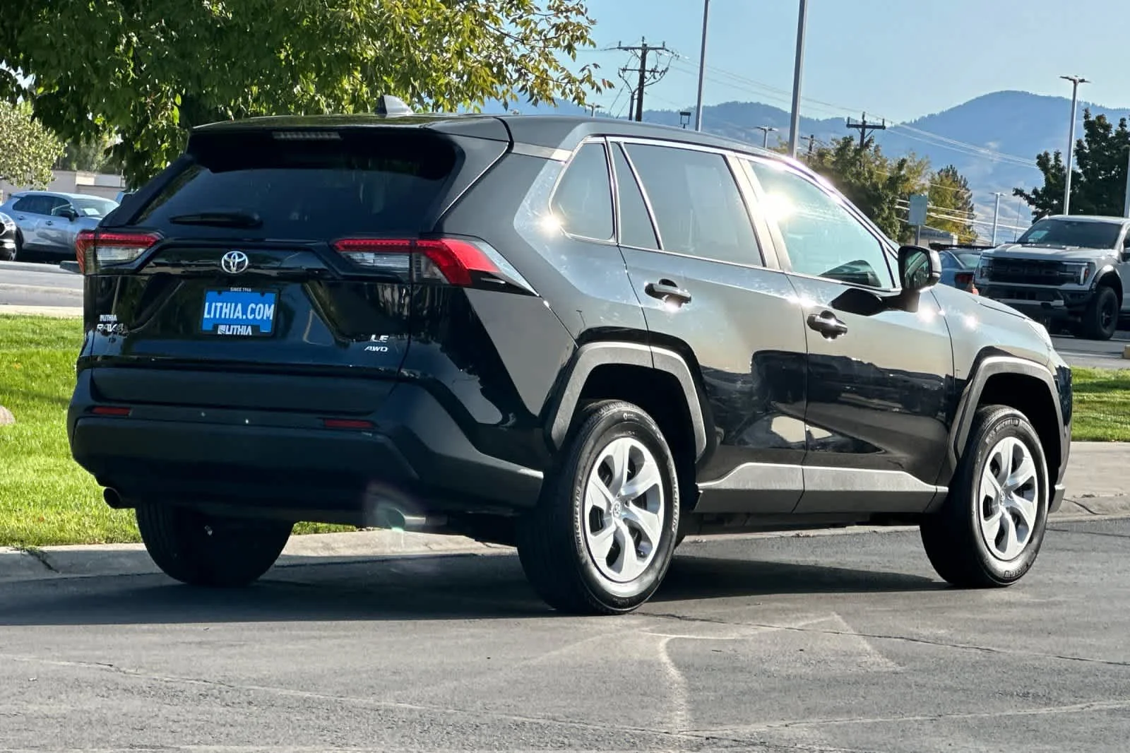 Certified Used 2025 Midnight Black Metallic Toyota LE image 2