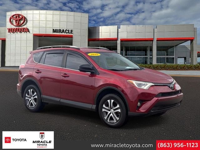 Used 2018 Red Toyota LE image 1