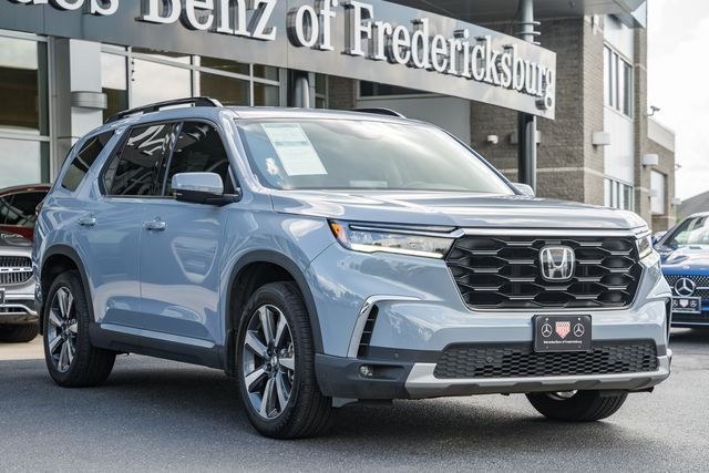 Used 2025 Sonic Gray Pearl Honda Touring+ image 1