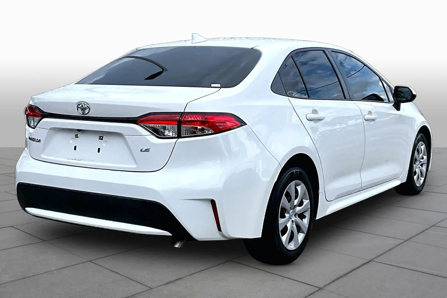 Used 2021 Super White Toyota LE image 13