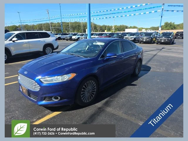 Used 2013 Blue Ford Titanium image 1