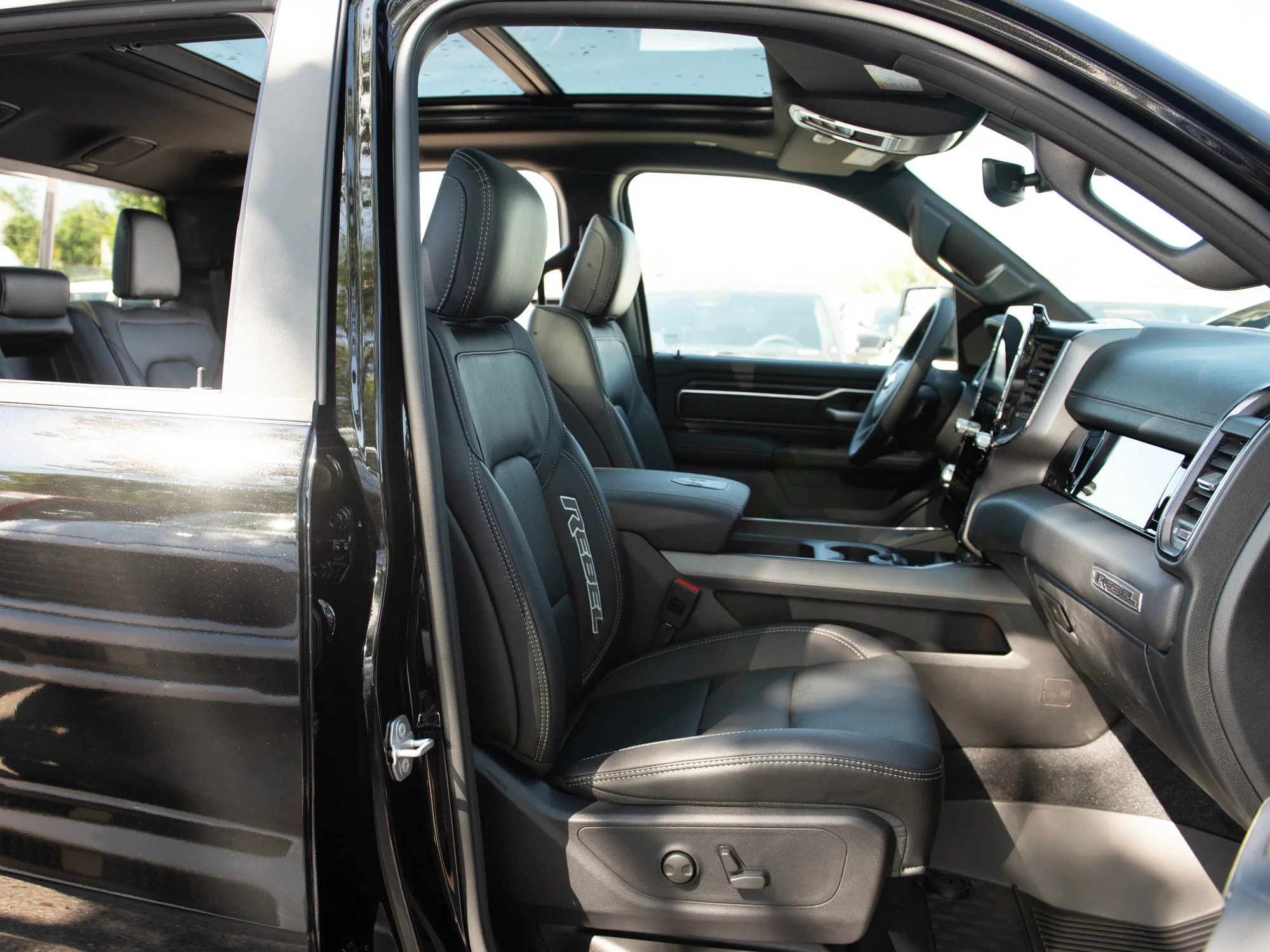 New 2026 Black RAM Rebel* Crew Cab 4x4, 33 Inch A/T Tires, Pano Sunroof, Passenger Screen image 28