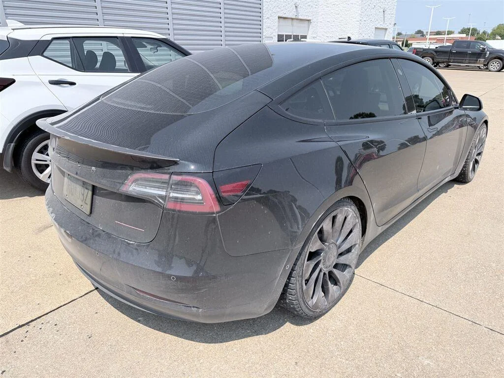 Used 2021 Solid Black Tesla Performance image 6