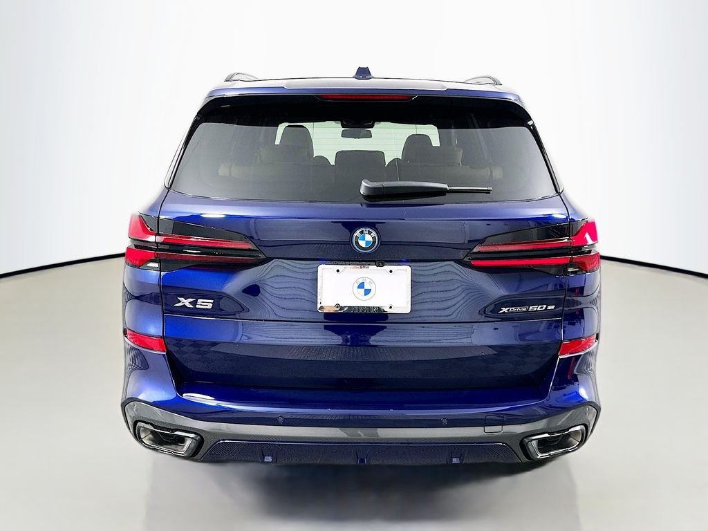 Used 2026 Tanzanite Blue II Metallic BMW xDrive50e image 6