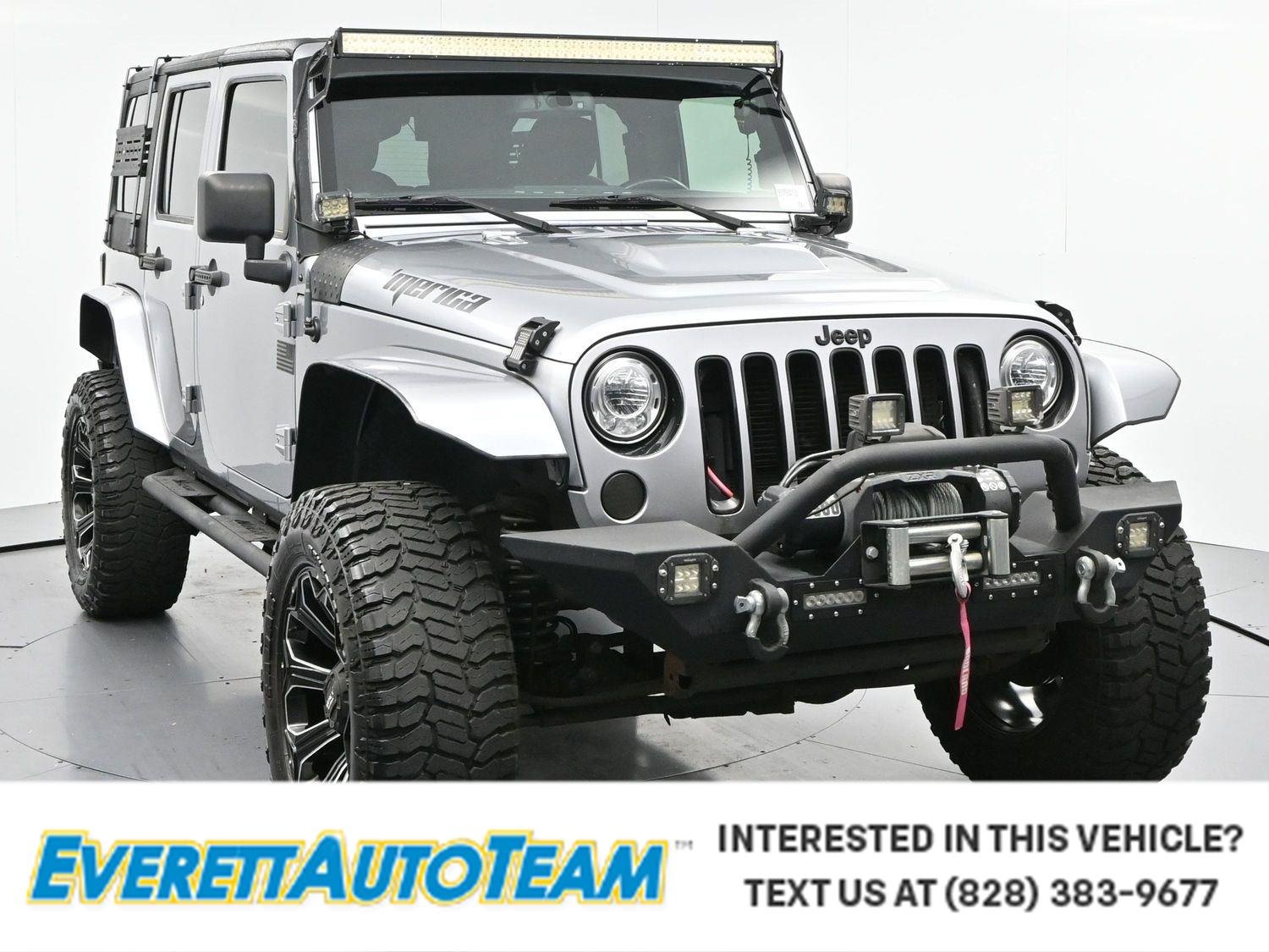 Used 2017 Billet Silver Metallic Clearcoat Jeep Smoky Mountain image 1