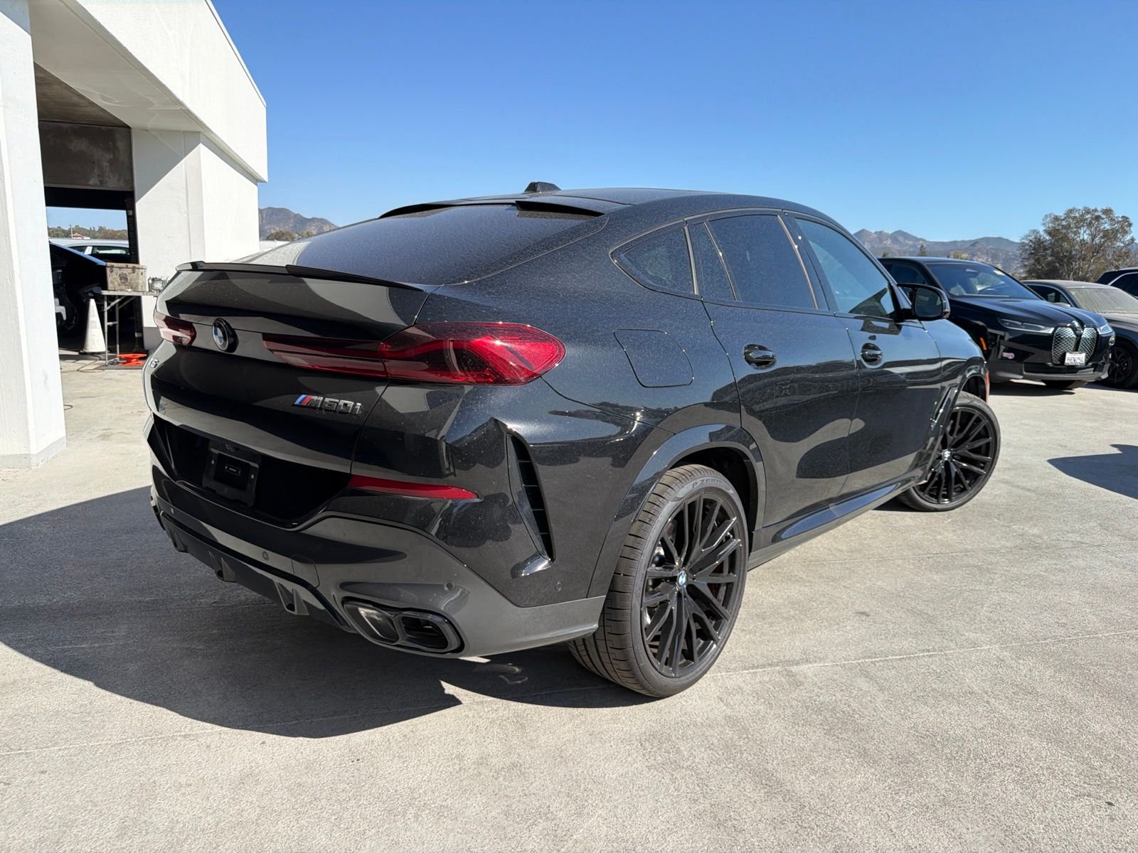 Used 2027 Black Sapphire Metallic BMW M60i image 4