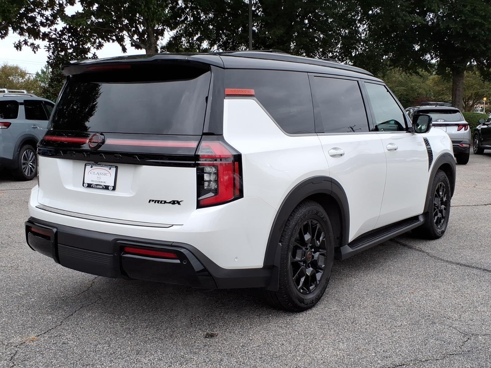 Used 2025 Aspen White Tricoat/Super Black Nissan PRO-4X image 7