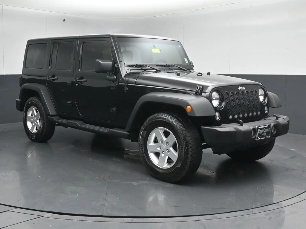 Used 2015 Black Jeep Unlimited Sport image 1