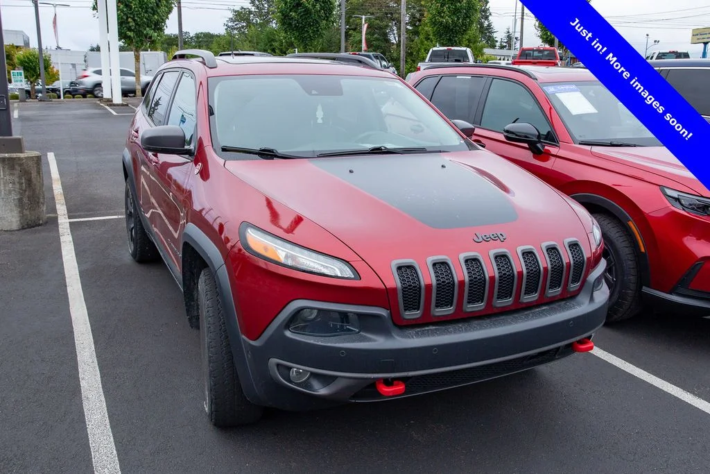 Used 2017 Deep Cherry Red Crystal Jeep Trailhawk image 1