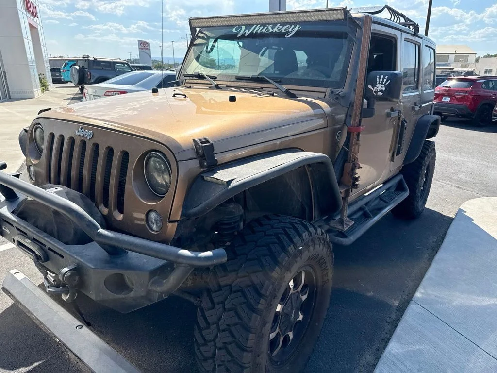 Used 2015 Jeep Wrangler Unlimited Sport with VIN 1C4BJWDG1FL642217 for sale in Delta, CO