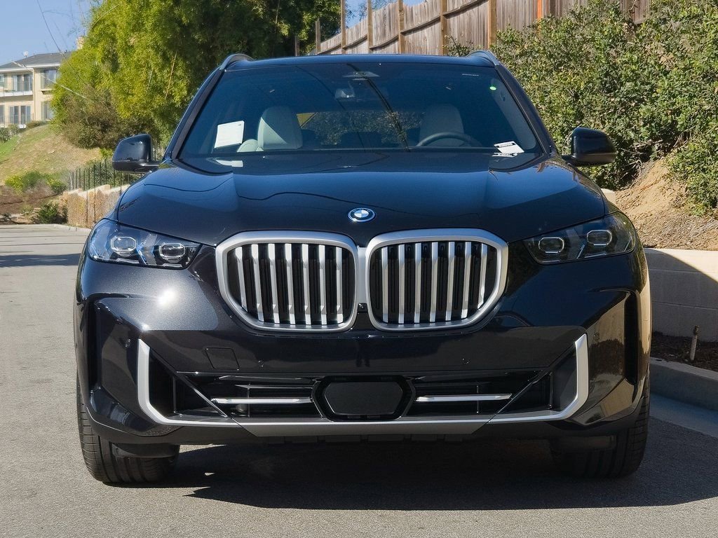 New 2026 Black Sapphire Metallic BMW xDrive50e image 3