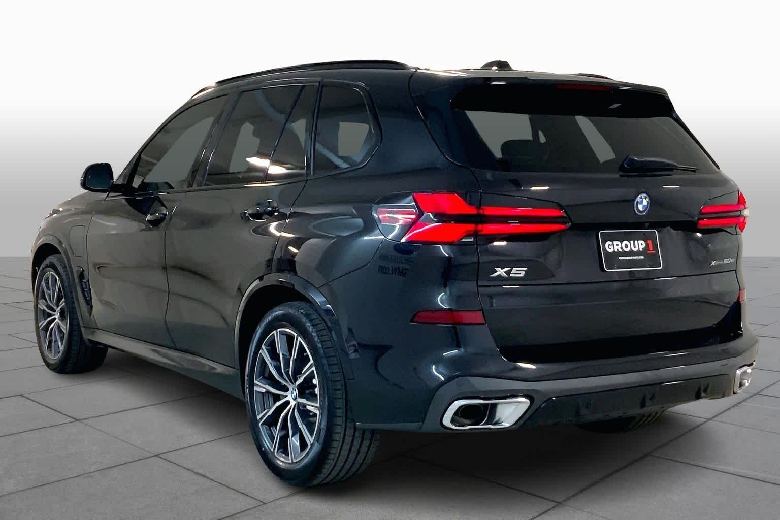 New 2026 Black Sapphire Metallic BMW xDrive50e image 13