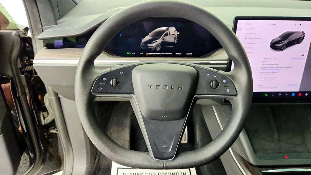 Used 2023 Solid Black Tesla AWD image 12