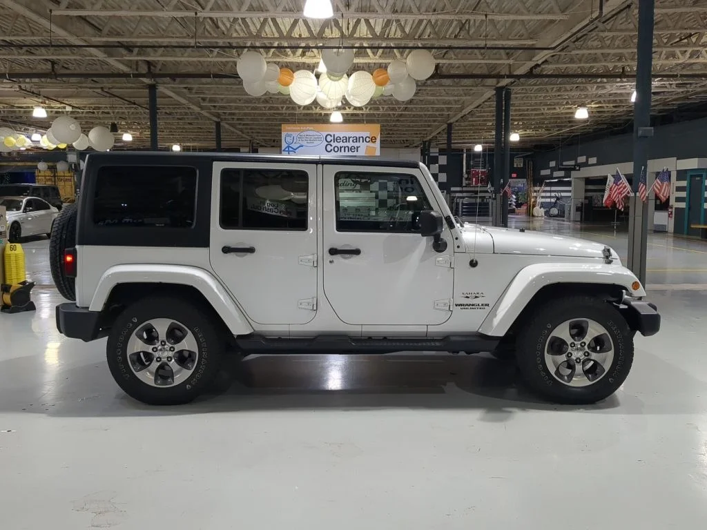 Used 2016 White Jeep Unlimited Sahara image 7