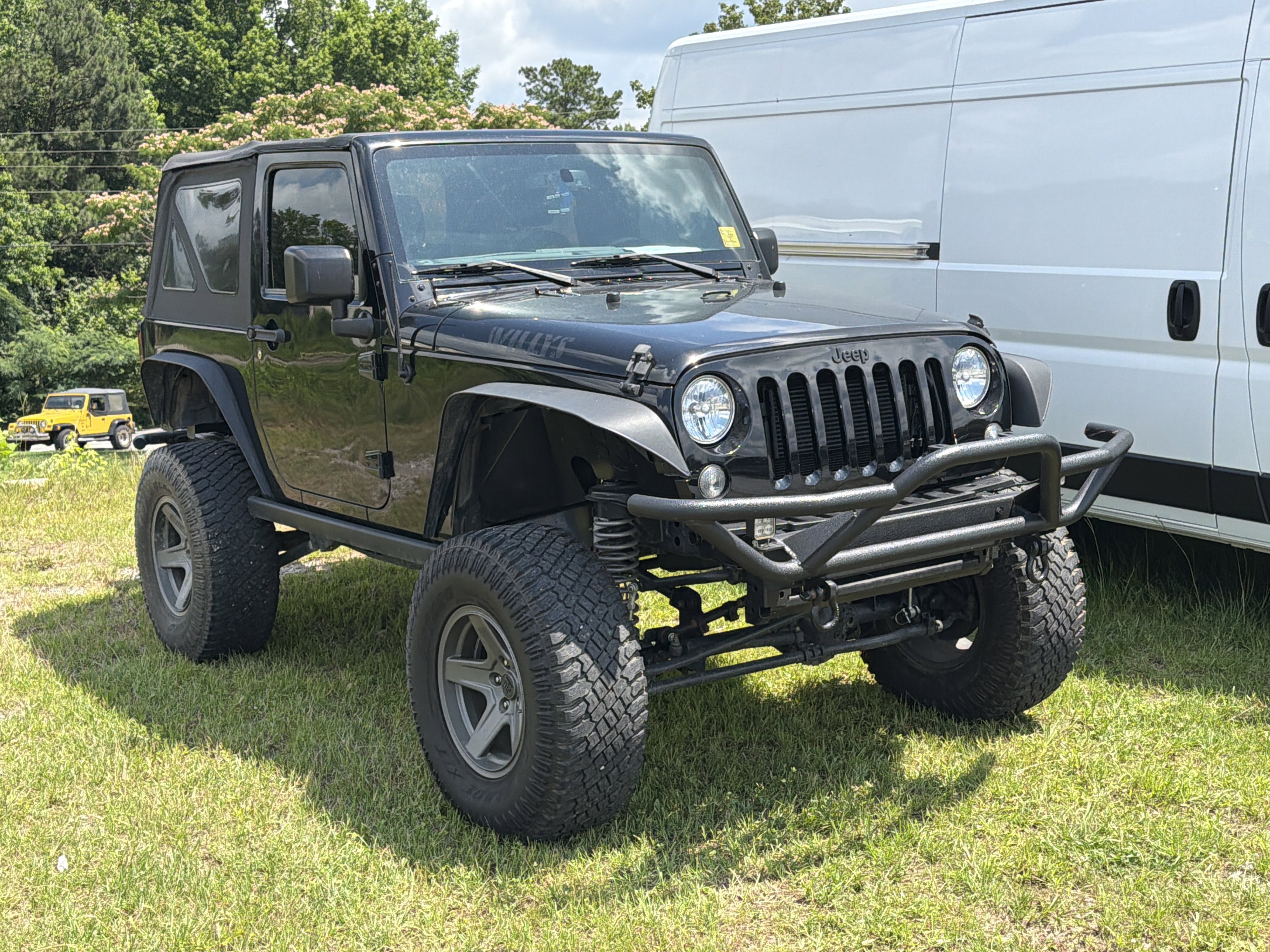 Used 2017 Black Clearcoat Jeep Willys Wheeler image 1