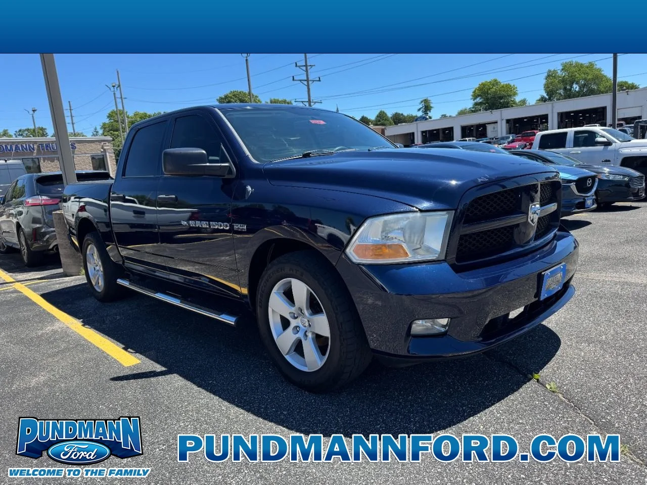 Used 2012 True Blue Pearlcoat Ram 2WD Crew Cab 140.5" Express image 1