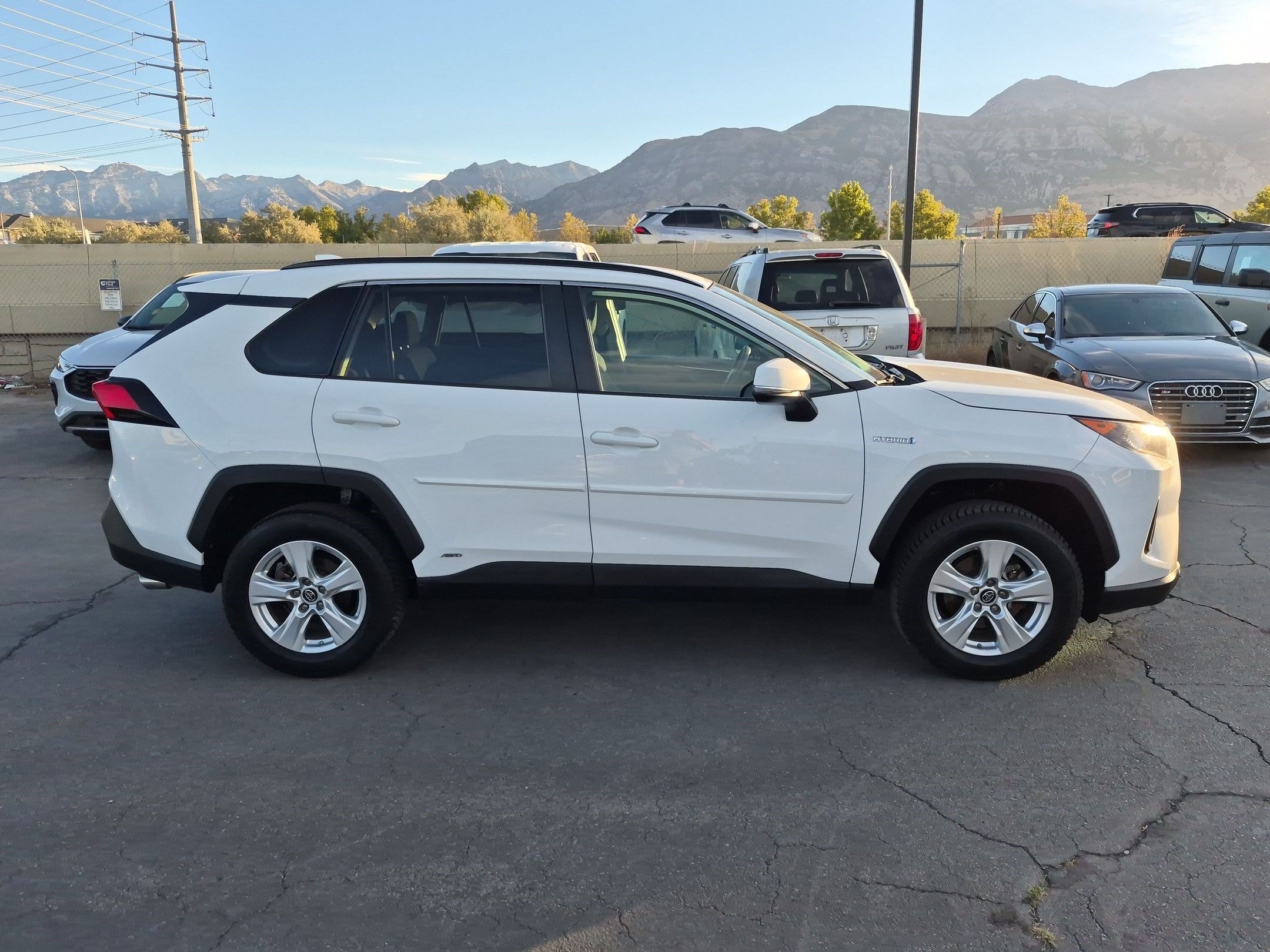 Used 2019 Super White Toyota Hybrid LE image 2