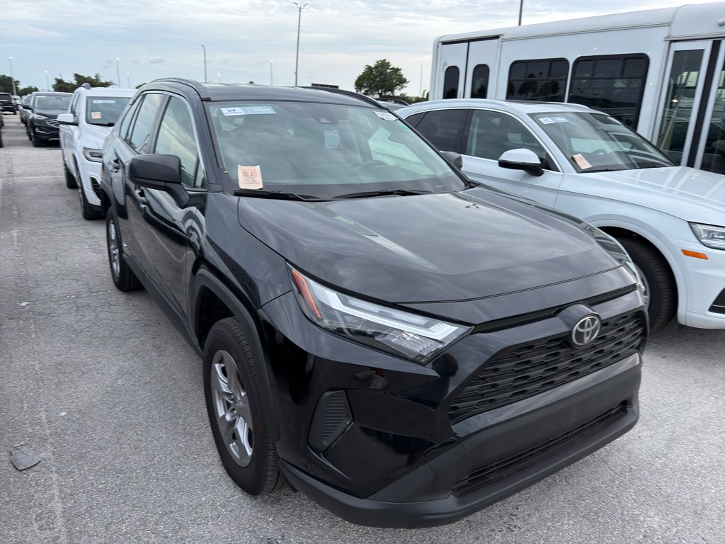 Used 2025 Midnight Black Metallic Toyota Hybrid LE image 1