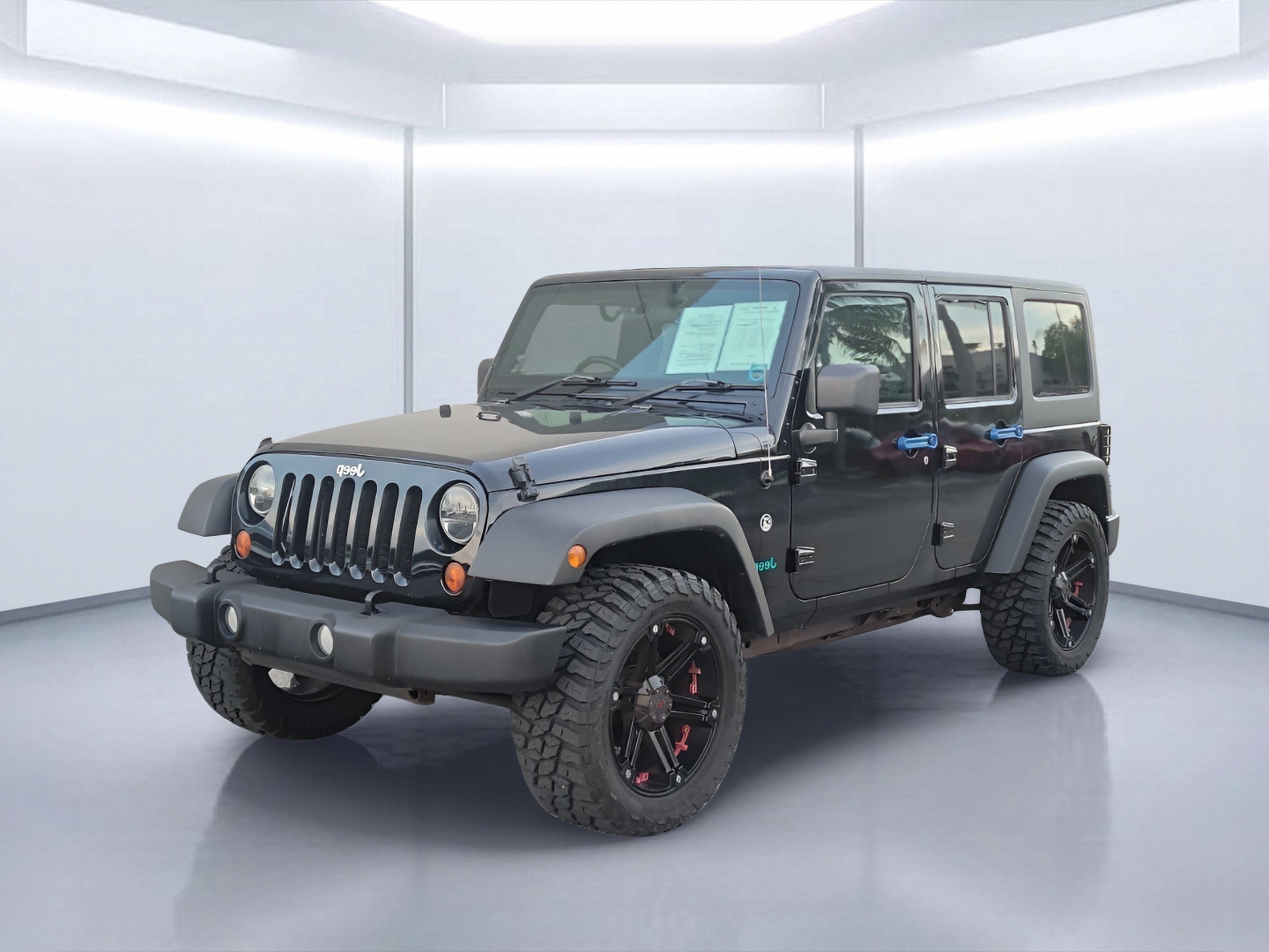 Used 2011 Black ClearCoat Jeep Unlimited Sport image 2