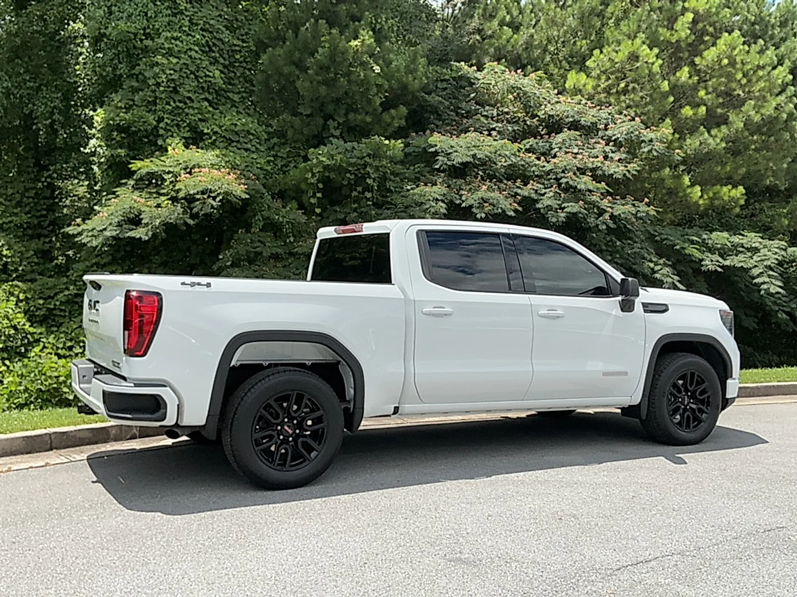 Used 2024 Summit White GMC 4WD Crew Cab Short Box Elevation with 3SB image 2
