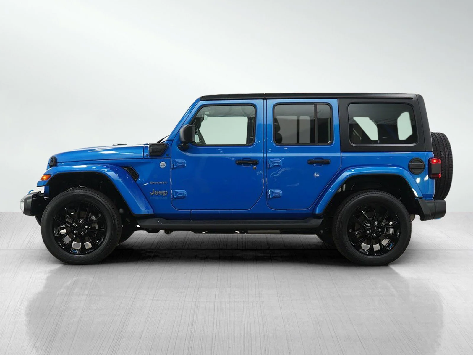 Used 2022 Jeep Wrangler Unlimited Sahara 4XE with VIN 1C4JJXP60NW236074 for sale in Hopkins, Minnesota