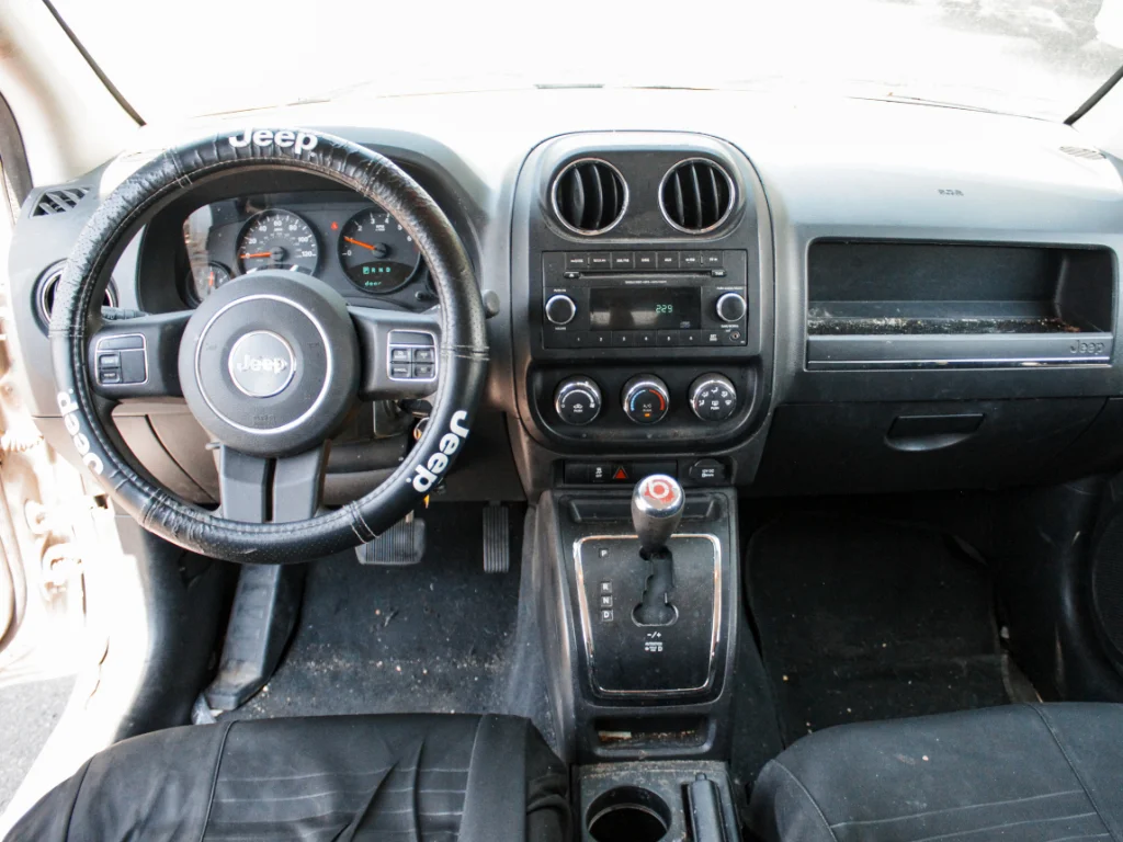 Used 2012 Bright Silver Metallic Clearcoat Jeep Sport image 19