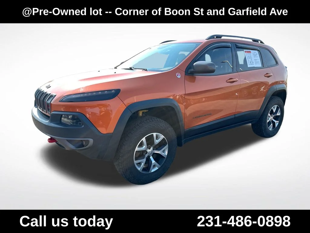 Used 2015 Orange Jeep Trailhawk image 1