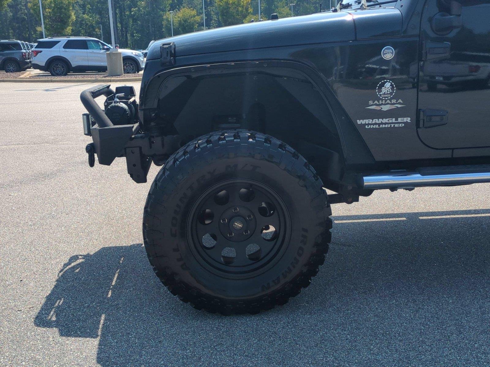 Used 2012 Black Clearcoat Jeep Sahara image 10