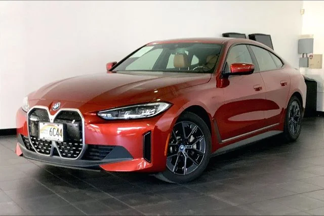 Used 2023 Sunset Orange Metallic BMW eDrive35 image 1