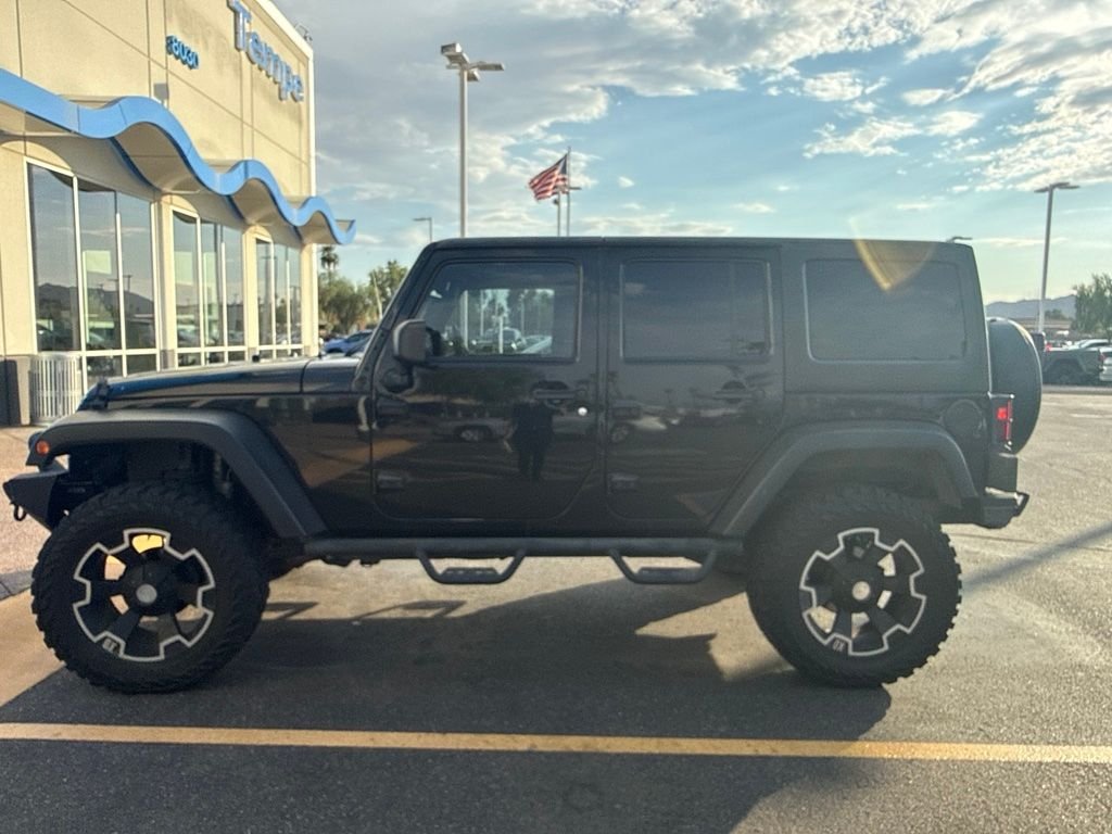 Used 2011 Black ClearCoat Jeep Unlimited Rubicon image 3