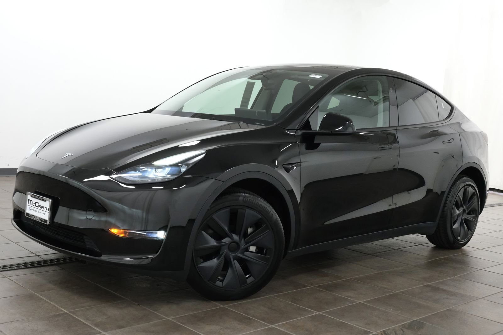 Used 2024 Solid Black Tesla Long Range image 1