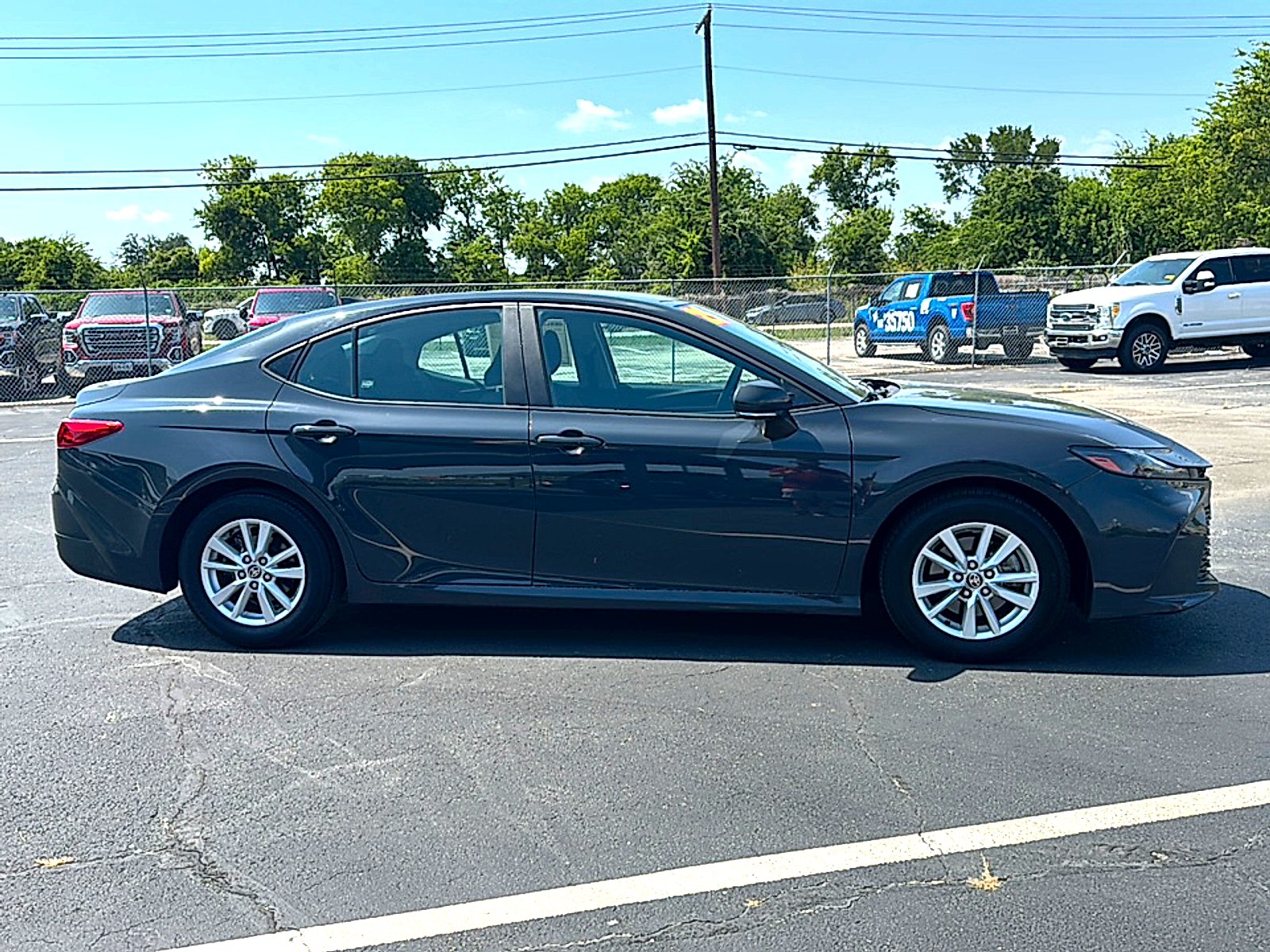 Used 2025 Super Black Toyota LE image 9