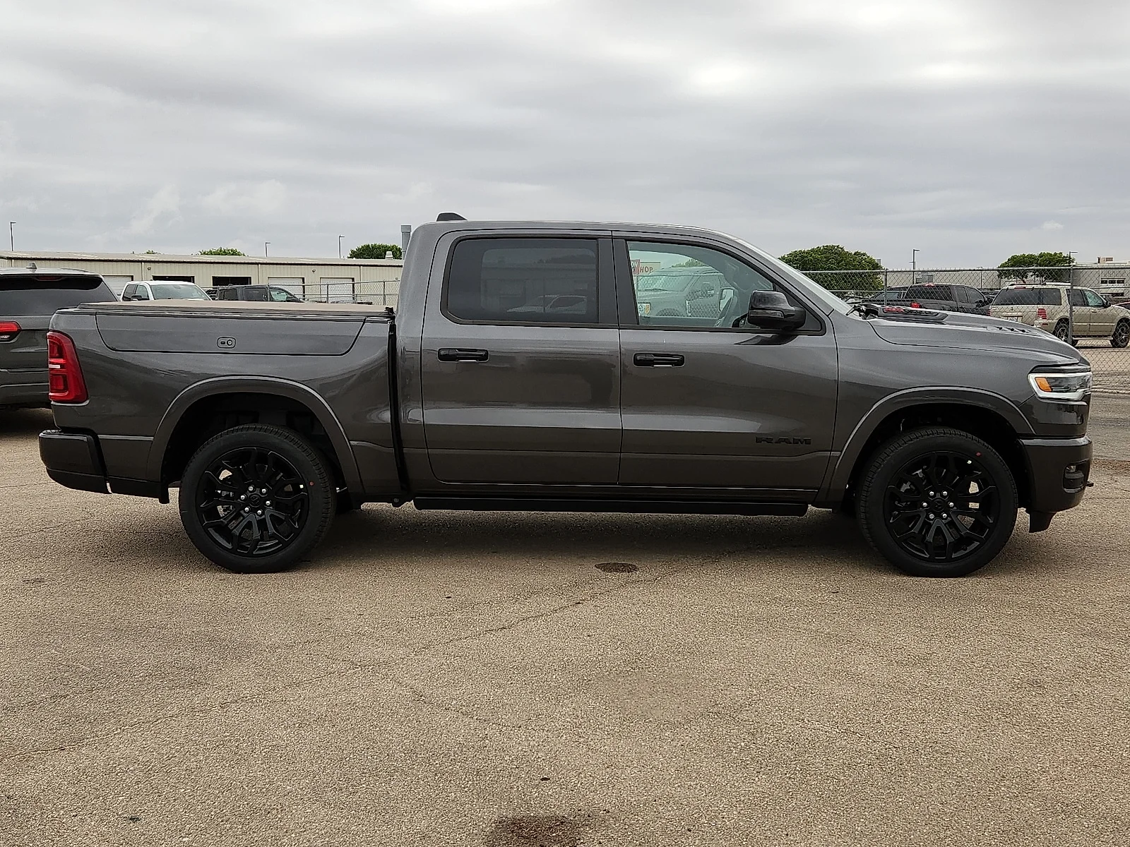 New 2026 Granite Crystal Metallic Clearcoat Ram LIMITED CREW CAB 4X4 5