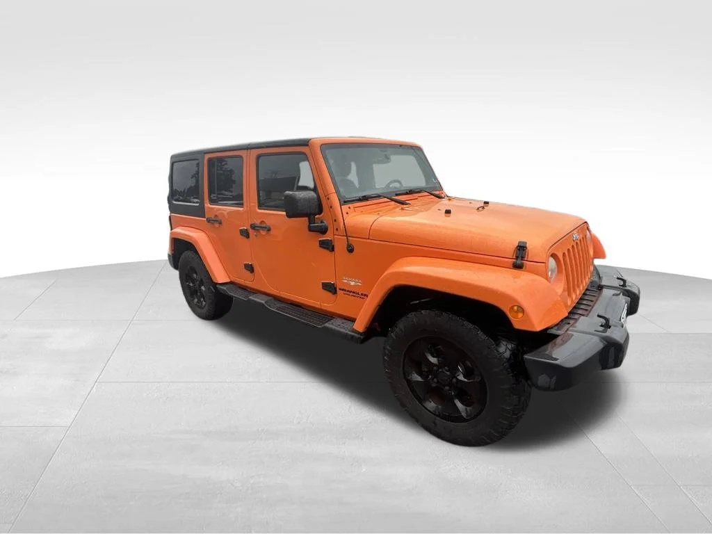 Used 2013 Orange Jeep Unlimited Sahara image 20